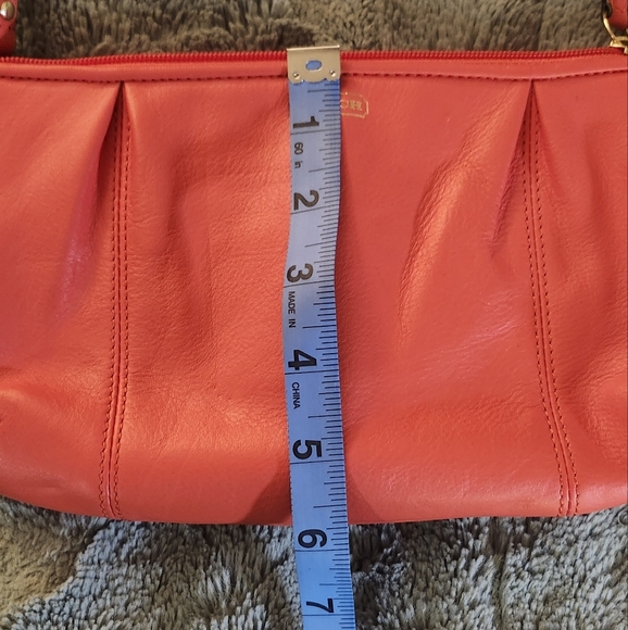 Like new Coach Large wristlet in redish or coral color - Picture 6 of 8